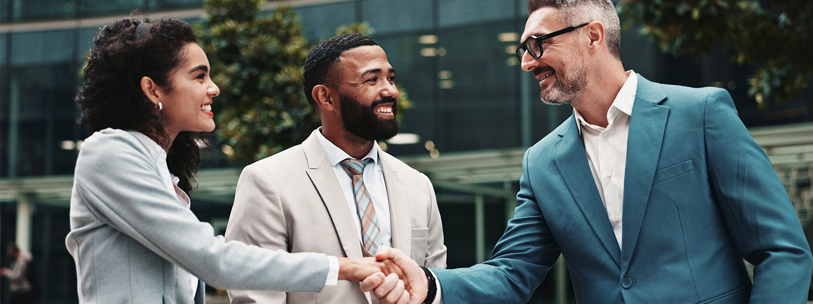 A photo of people meeting and shaking hands