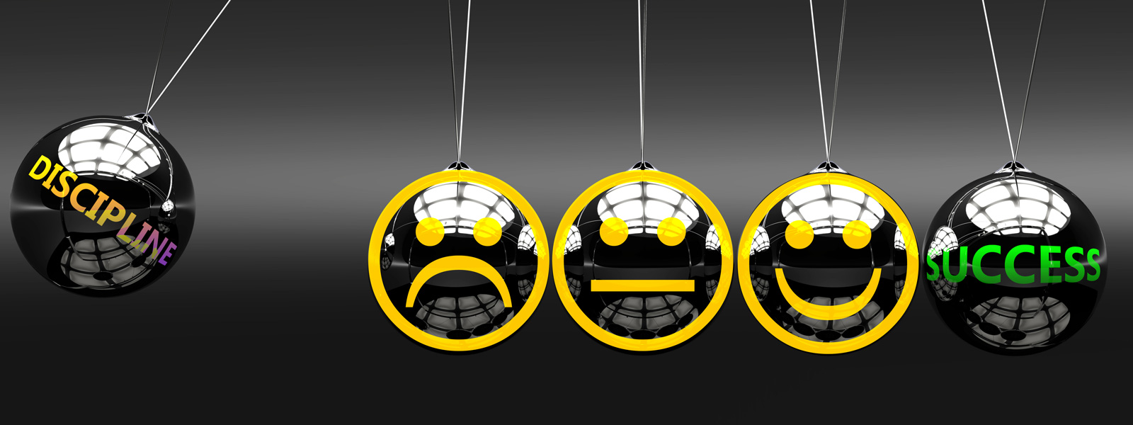 A newtons cradle with progressively happier faces on each ball