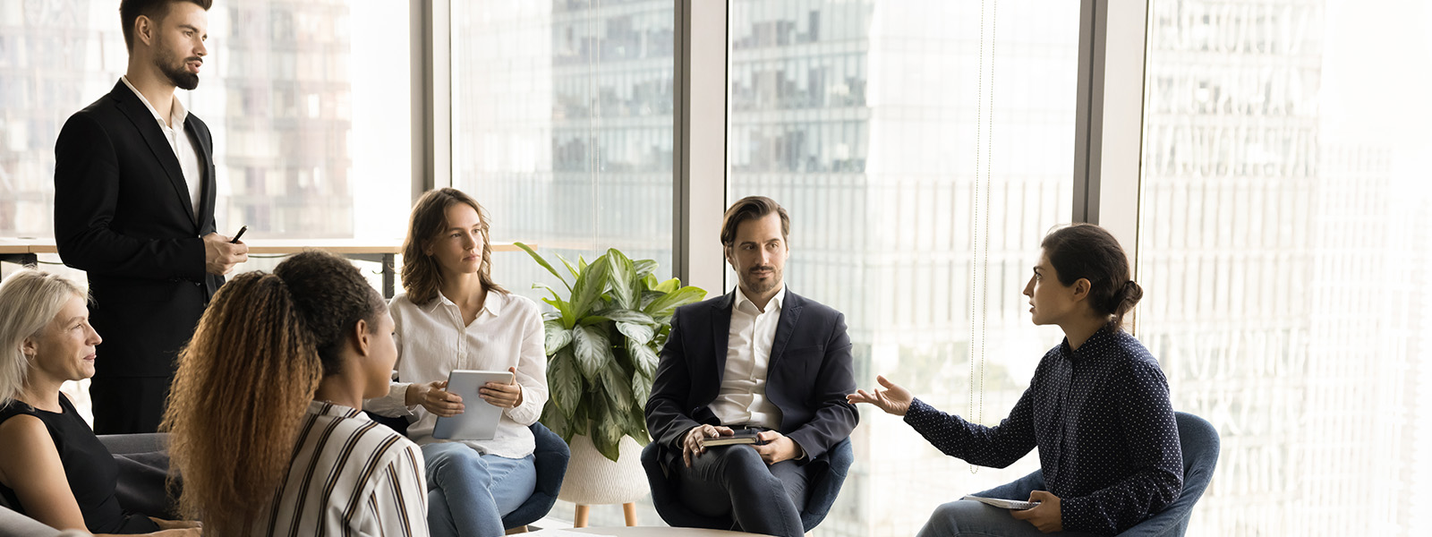 Group of people in suits discussing