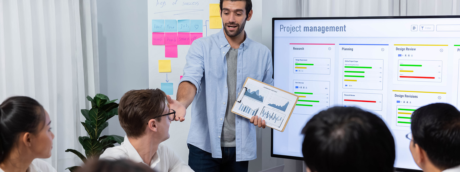 Man presenting project data to a team