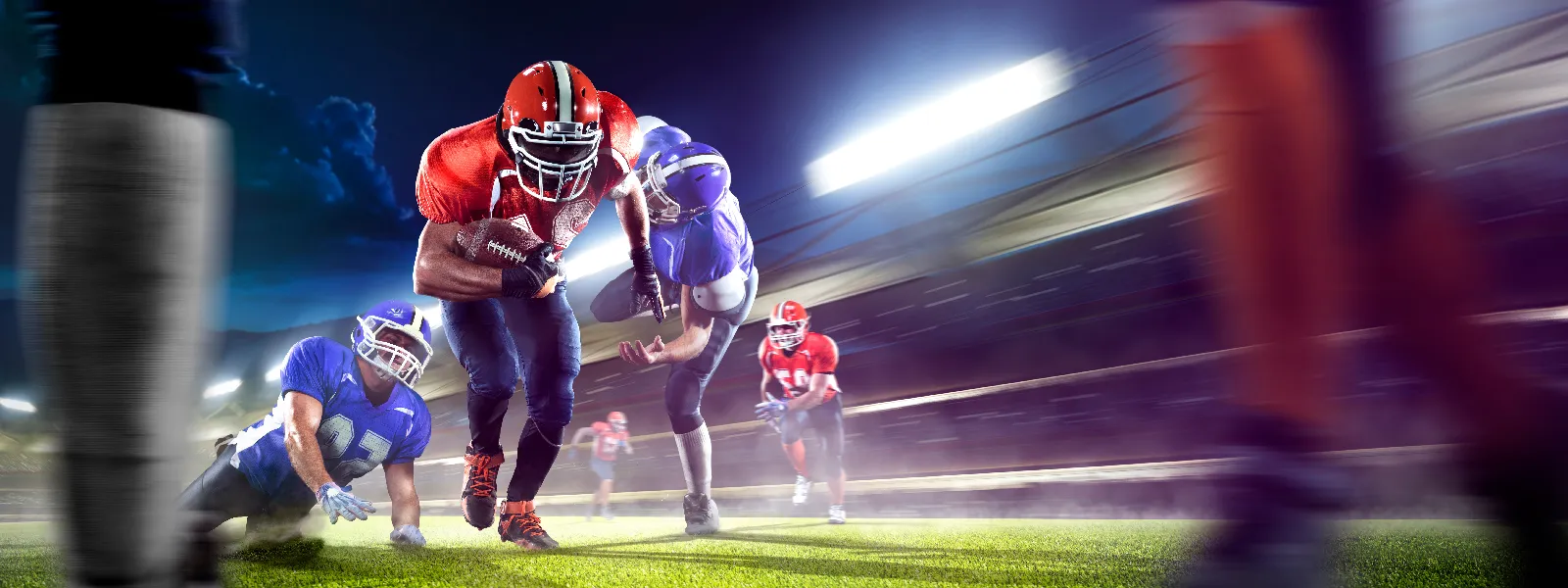 a quarterback charges through a hole in the defensive line